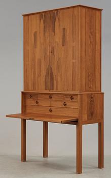 A Carl Malmsten mahogany cabinet with inlays of different types of wood, signed and dated 1958.