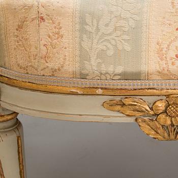 A Gustavian style sofa and table from early 20th century.