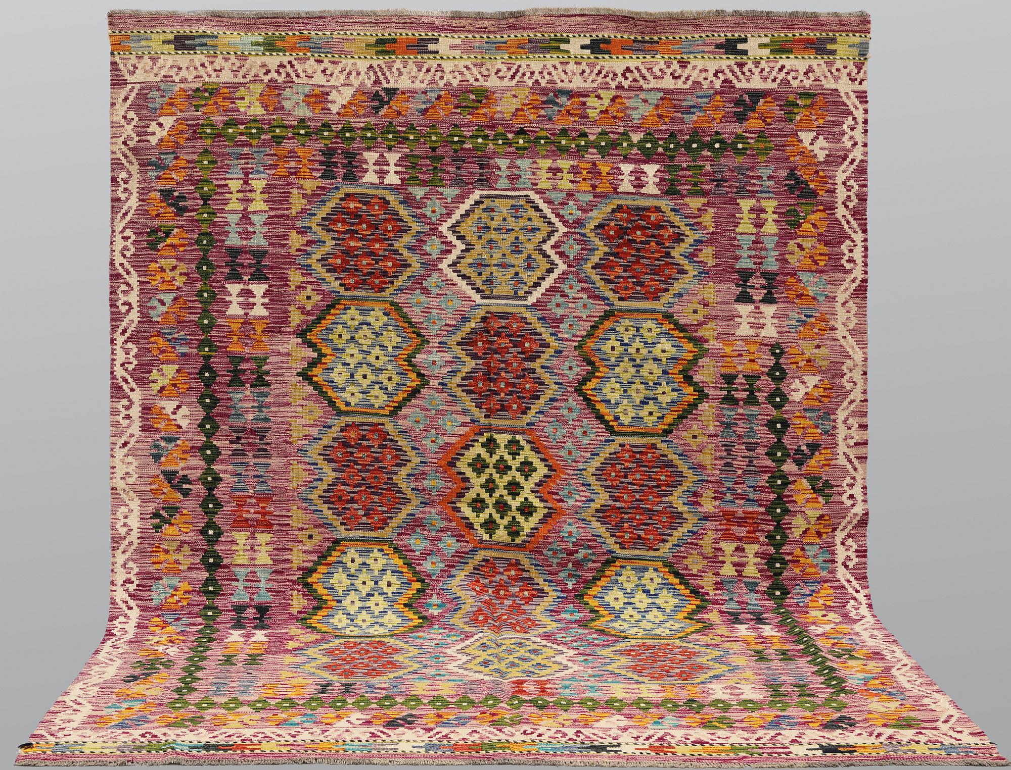 A Kilim rug, approx. 244 x 197 cm.
