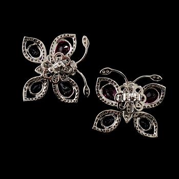 A pair of amethyst, ca 2.00 cts, tourmaline ca 5.80 cts and diamond, ca 1.30 cts earrings in the shape of butterflies.