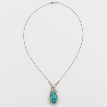 A platinum and black opal necklace set with old- and eight-cut diamonds.