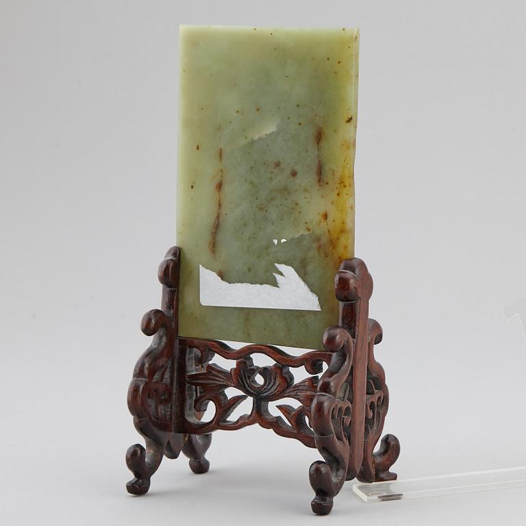 A Chinese green stone sculpture, 20th century.