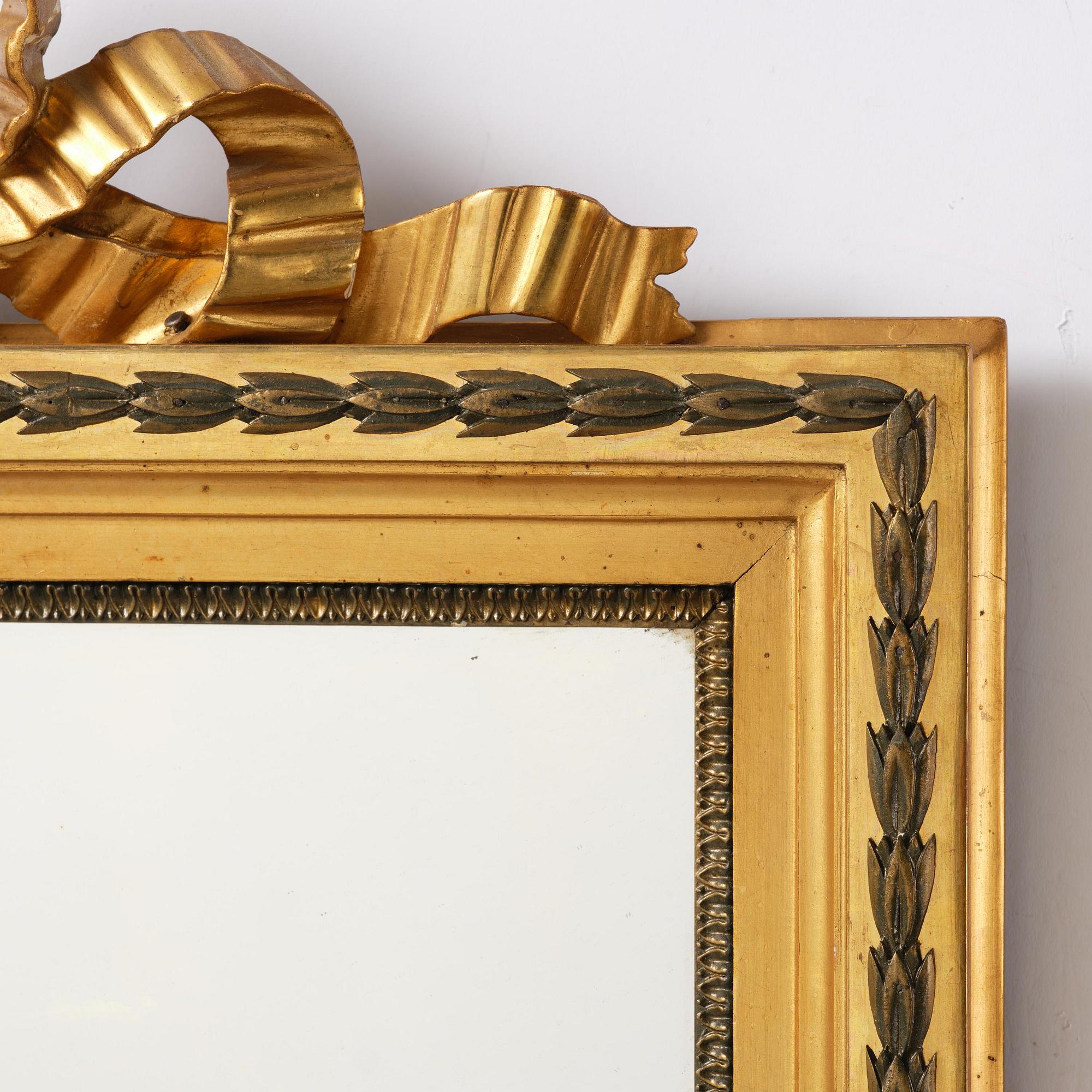 A pair of two-branch giltwood girandole mirrors attributed to P. Ljung (1743-1819).