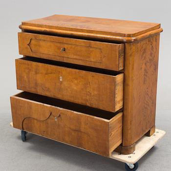 A late empire chest of drawers, mid 19th century.