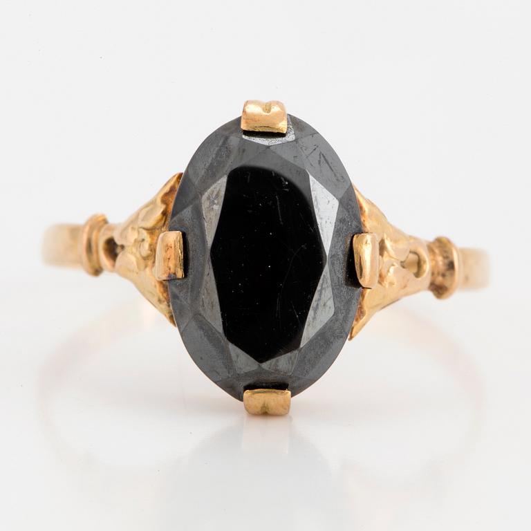 A faceted hematite ring.