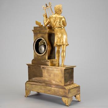 A French gilt bronze Empire mantle clock, early 19th Century.