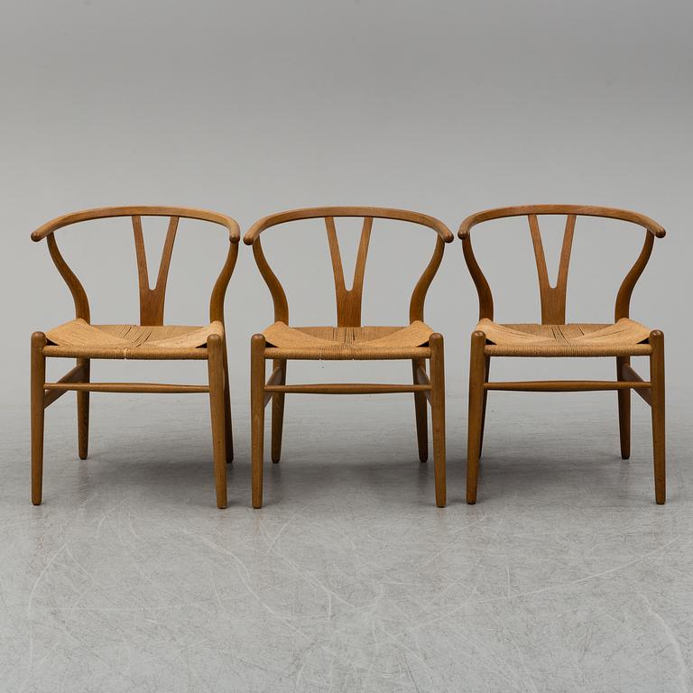 Three armchairs, 'Wishbone Chair' by Hans J Wegner, Carl Hansen & Son, Odense, Denmark.