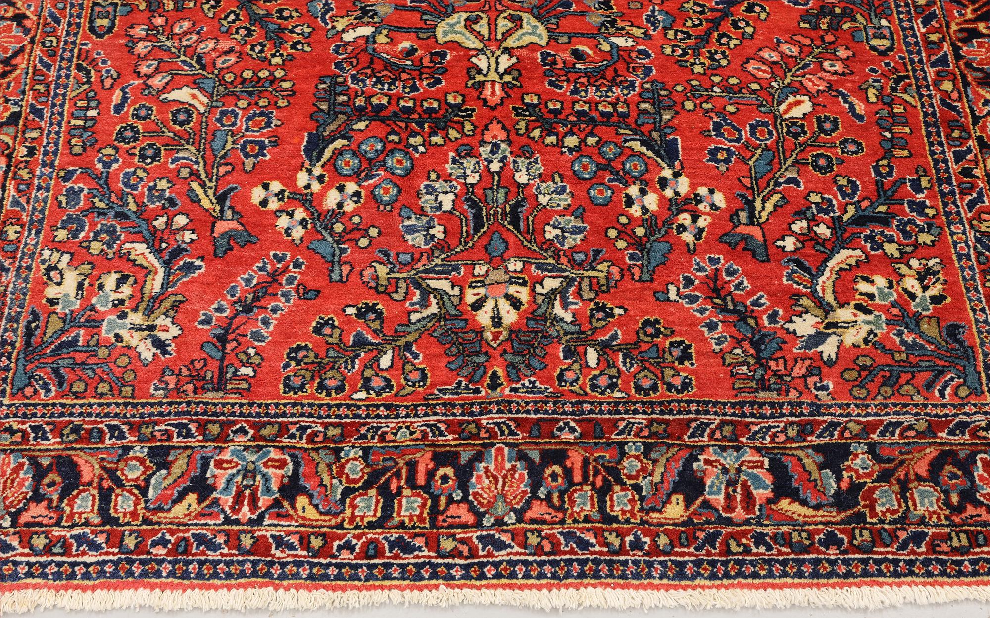 An American Sarouk rug, semi-antique, c. 200 x 142 cm.