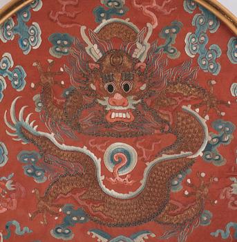 An embroidered dragon roundel from the surcoat of an Emperor or Imperial son, Qing dynasty, 19th century.
