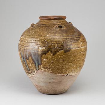 A olive green glazed jar, South East Asia, 18th Century or older.