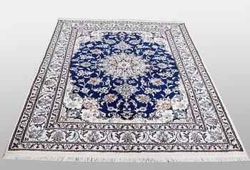 A Nain rug, part silk, ca 205 x 152 cm.
