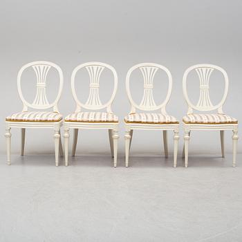 Four chairs with dinner table, late 20th Century.