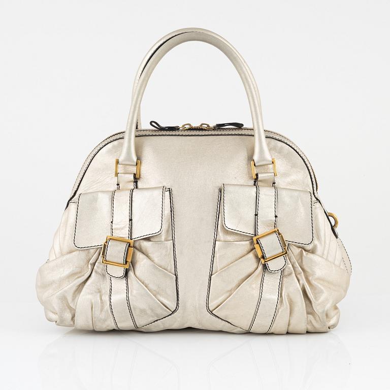 Valentino Garavani, A metallic leather bag.