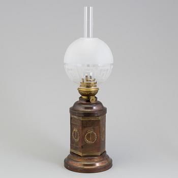 A COPPER OIL LAMP, ca 1900.