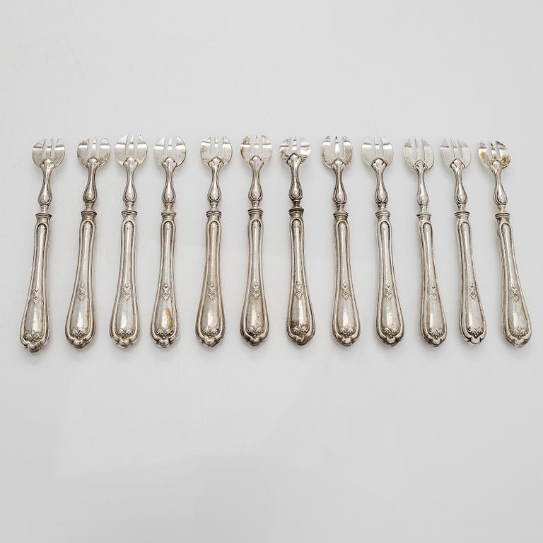 A set of twelve Belgian silver oyster forks.