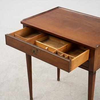 A late Gustavian mahogany writing table from araound the year 1800.