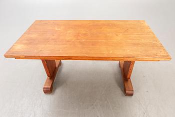A 1940s pine dining table.