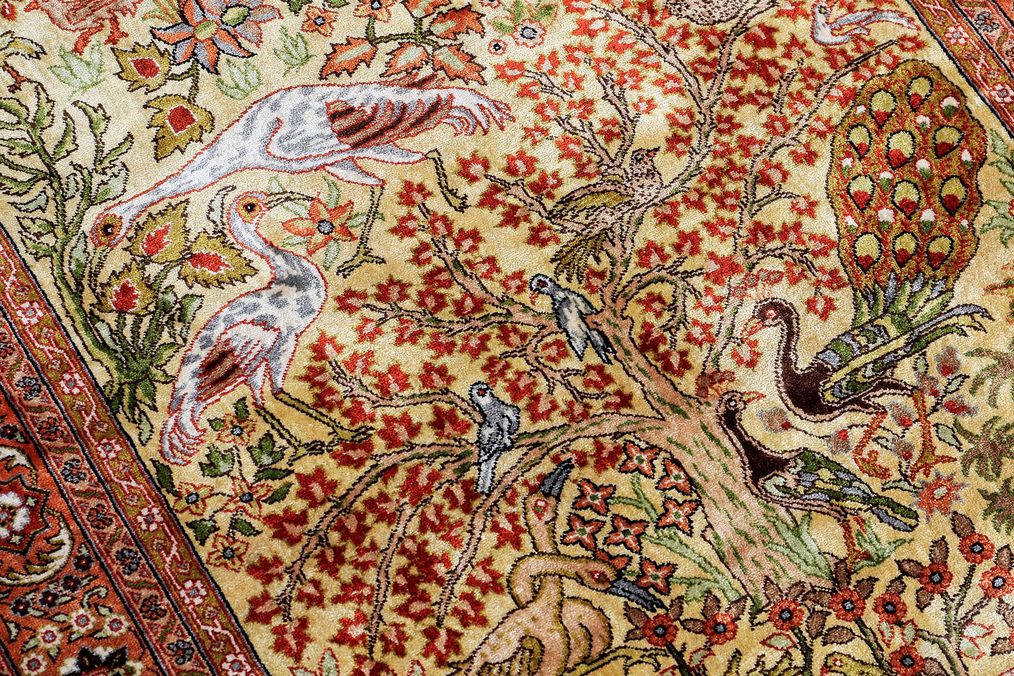 An Oriental figural silk rug, ca 126 x 83 cm.