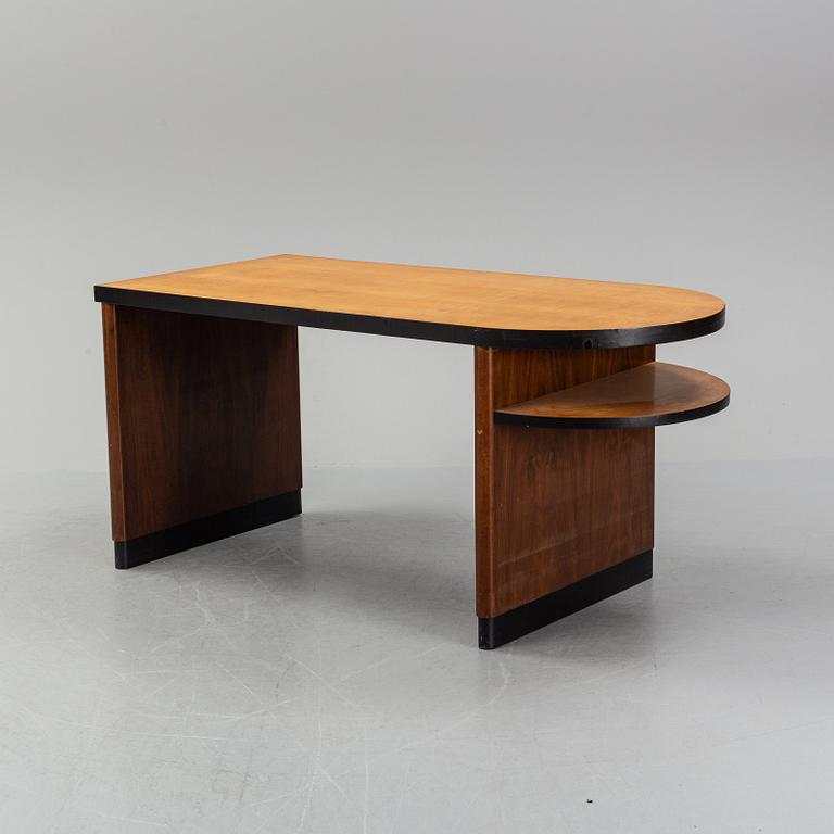Axel Einar Hjorth, attributed to. A walnut and birch desk, Nordiska Kompaniet, 1930's.