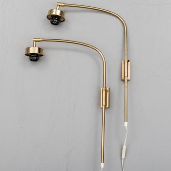 A pair of brass wall lamps by Josef Frank for Firma Svenskt Tenn.