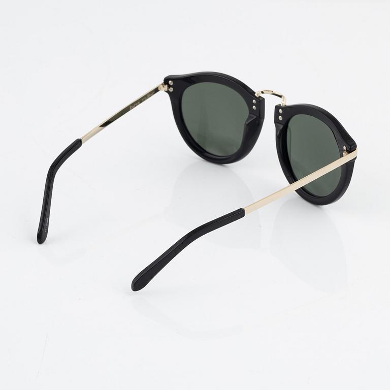 Karen Walker, a pair of "Harvest" sunglasses.