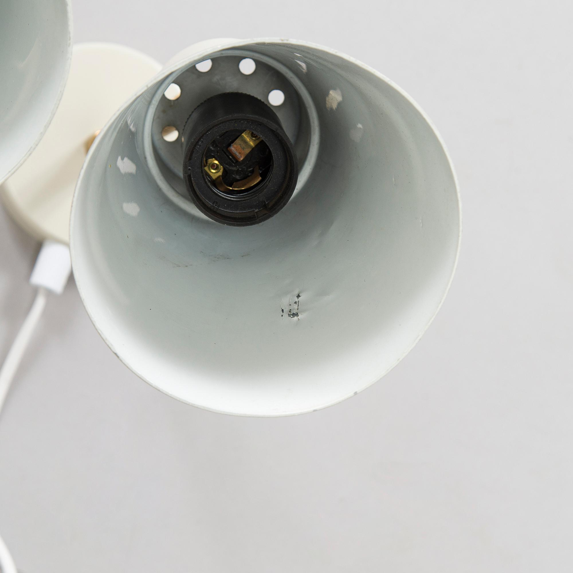 A set of three mid-20th century wall lights, model AH6, for Itsu Finland.