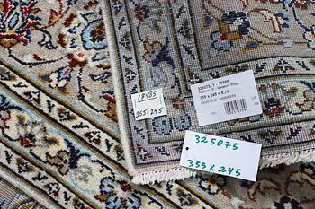 A Kashan carpet, c. 355 x 245 cm.