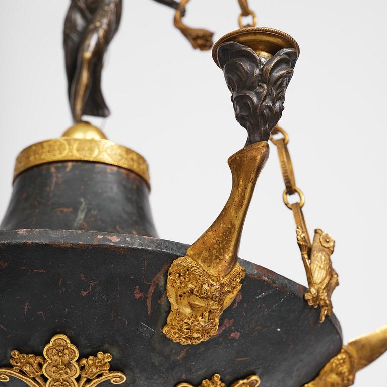 A patinated and ormolu six-light Empire chandelier, Stockholm, first part 19th century.