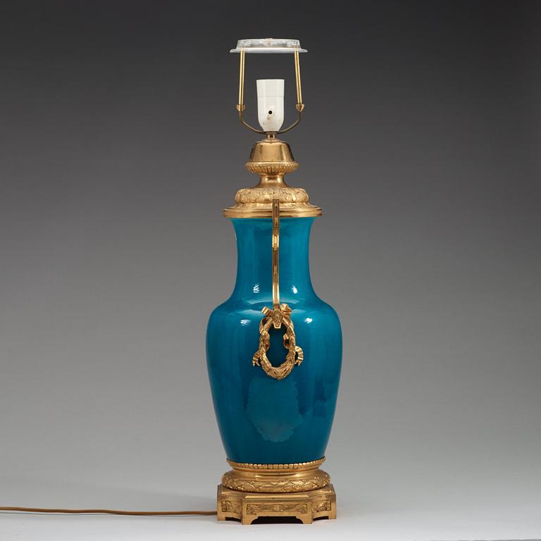 A turquoise glazed bronze mounted porcelain vase, Qing dynasty, 19th century.