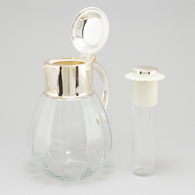 A glass and metal jug, second half of the 20th century, purchased from Firma Svenskt Tenn.