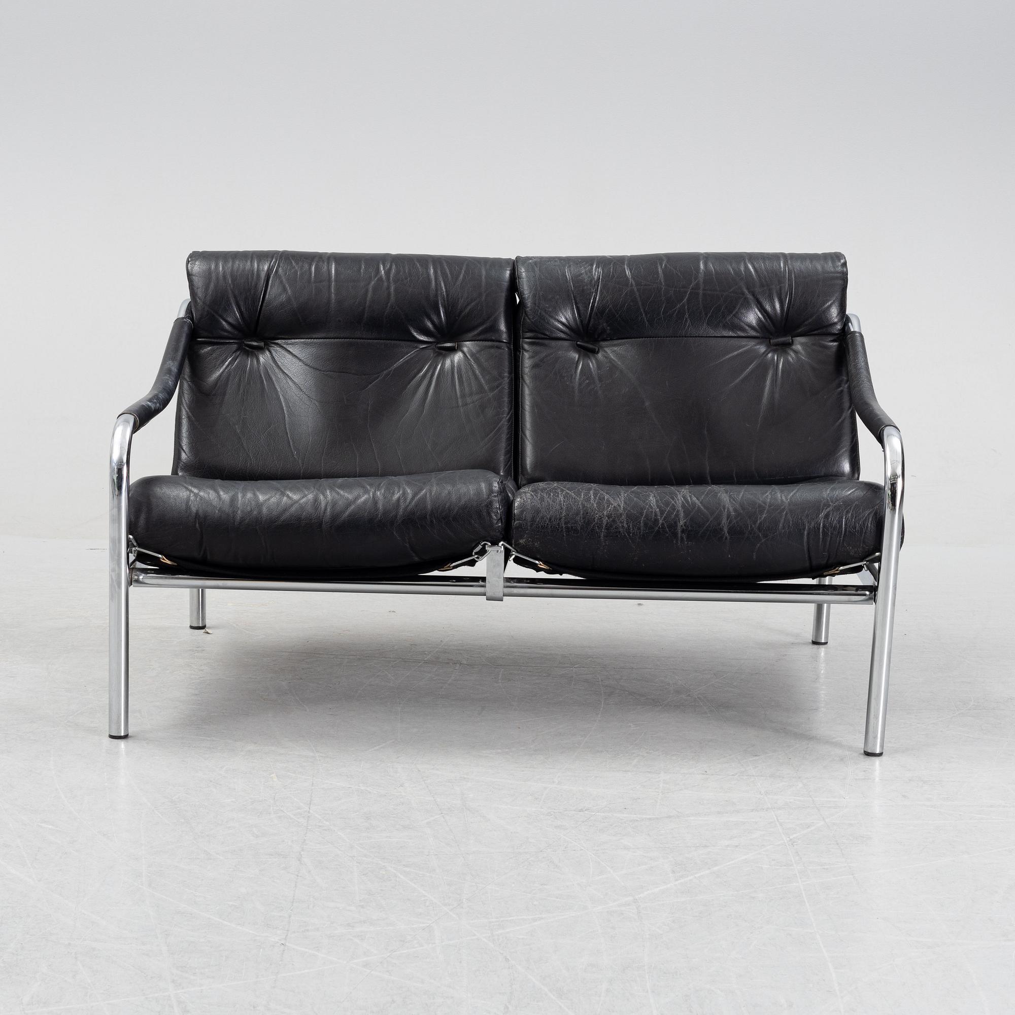 A 1960's leather upholstered 'Kadia' sofa  by Tim Bates for Pieff.