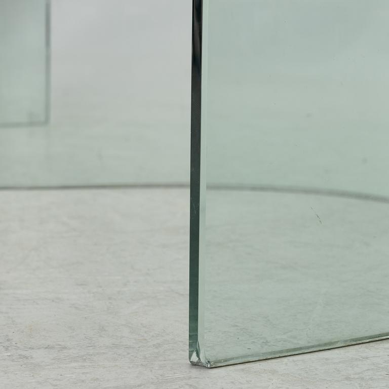 A dining table, glass, contemporary.