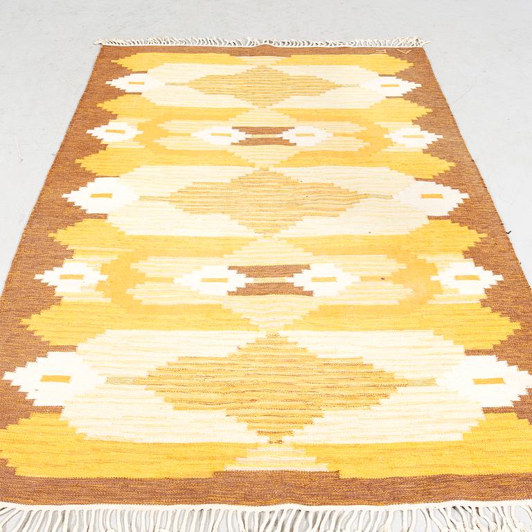 A Swedish signed flat weave carpet ca 225x165 cm.