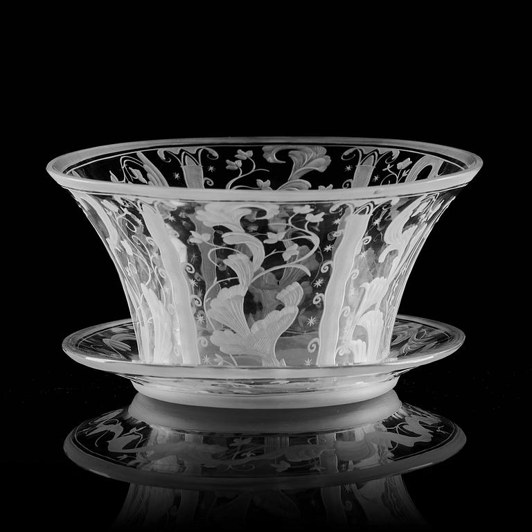 Simon Gate, a Swedish Grace engraved glass bowl with stand, Orrefors 1930, model 147, engraved by Karl Rössler.
