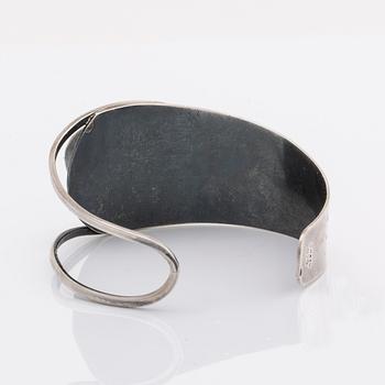 2 silver bracelets, 1 with a green stone, wider bracelet swedish import mark, original invoice dated 1977.
