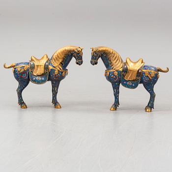 A pair of Chinese cloissoné horses, 20th Century.