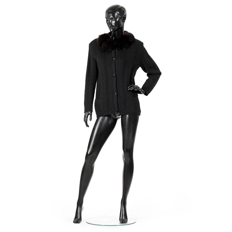 YVES SAINT LAURENT, a black cardigan with brown fox fur trimming.