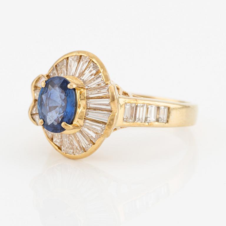 Ring, 18K gold with sapphire and baguette-cut diamonds.