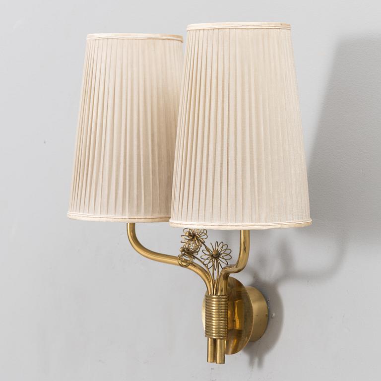 A mid-20th century wall light model 9446 for Taito, Finland.