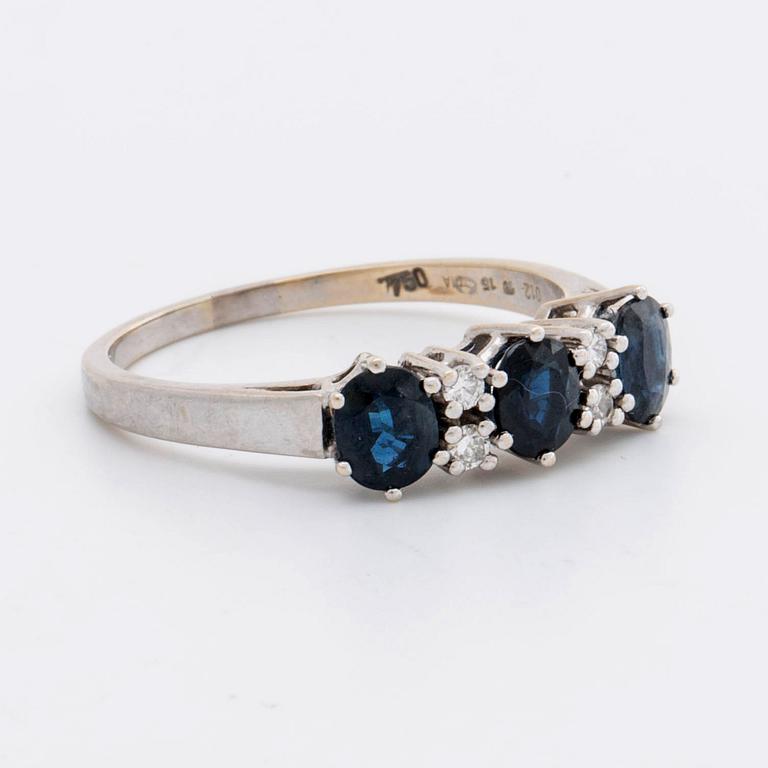 RING 18k whitegold w 3 sapphires 5 x 4 mm and 4 brilliant-cut Diamonds 0,12 ct in total engraved.