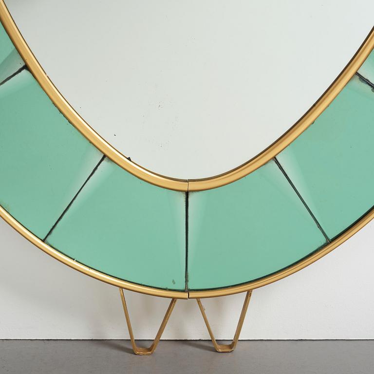 Italian designer, a wall mirror, 1950-60's. Emerald green tinted glass and brass frame.