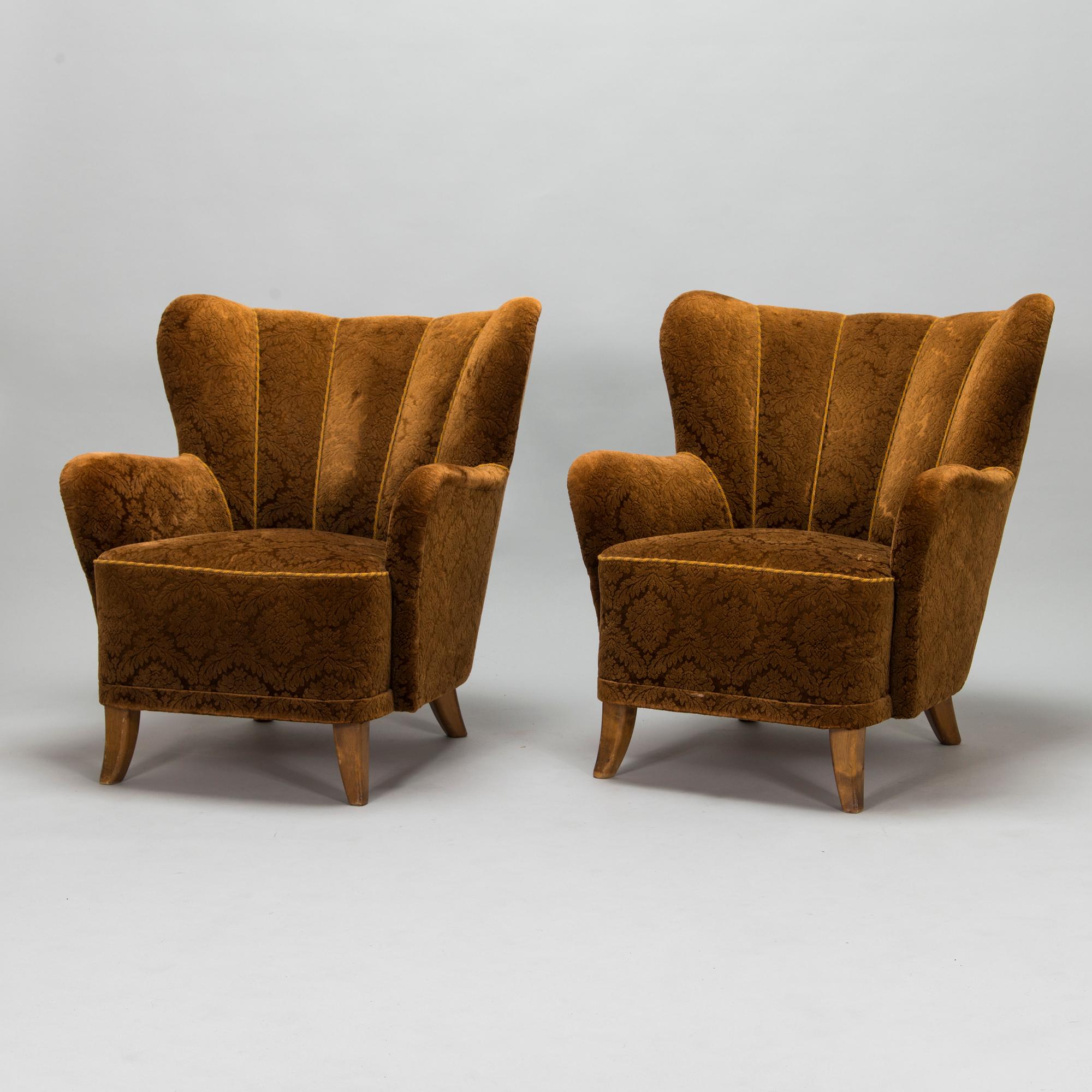 A pair of mid-20th-century armchairs.