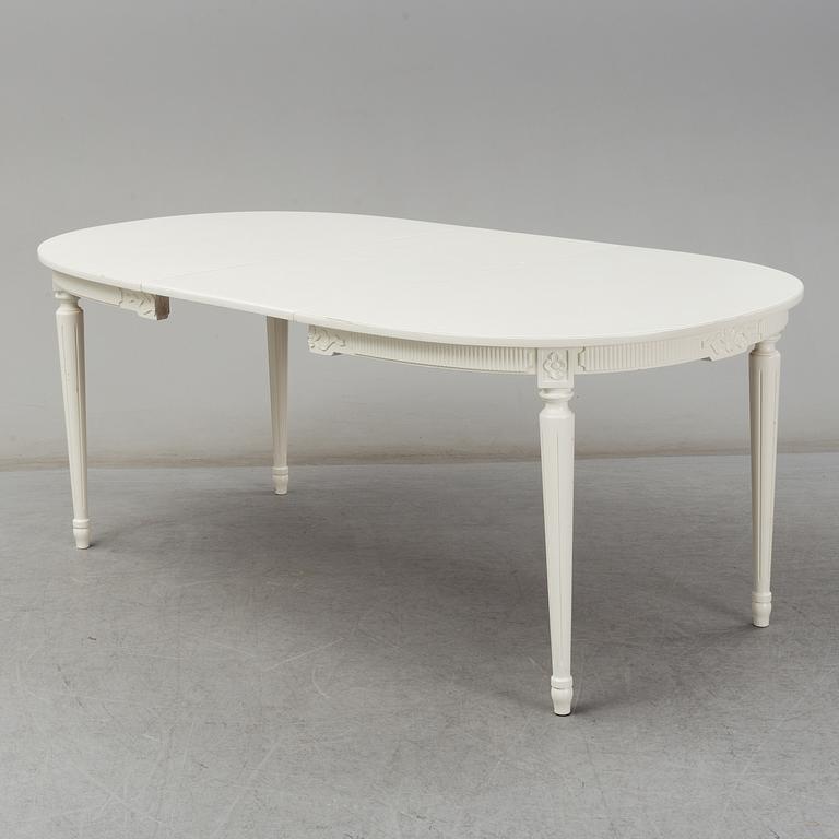 A dining table and four chairs, Gustavian style, second half of the 20th century. One leaf included.