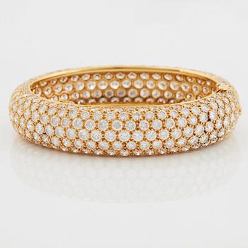 Cartier armring 18K guld med runda briljantslipade diamanter.