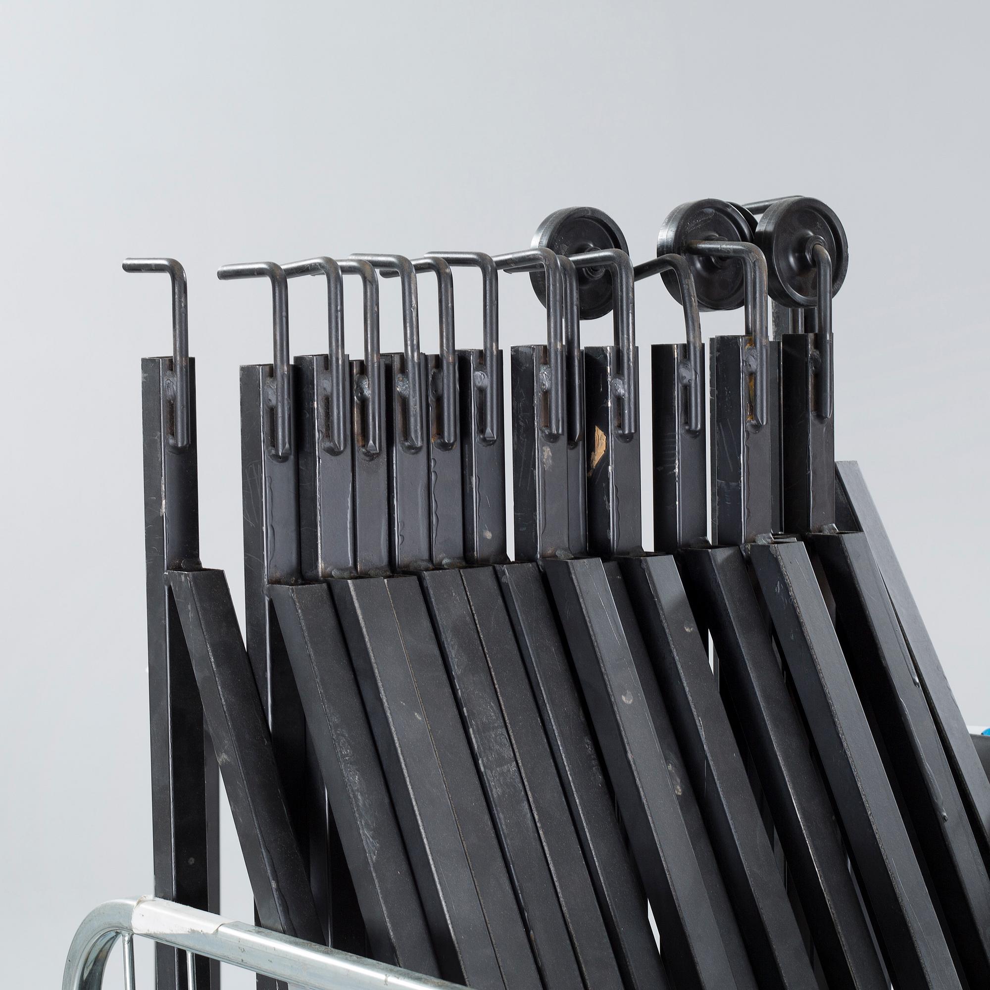 A 21st century showroom rug hanger.