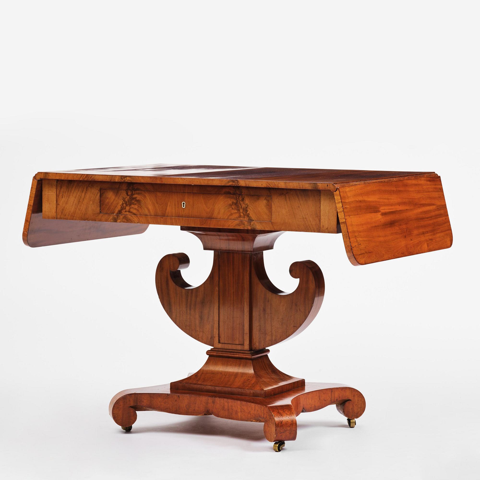 A Swedish Empire mahogany center table.