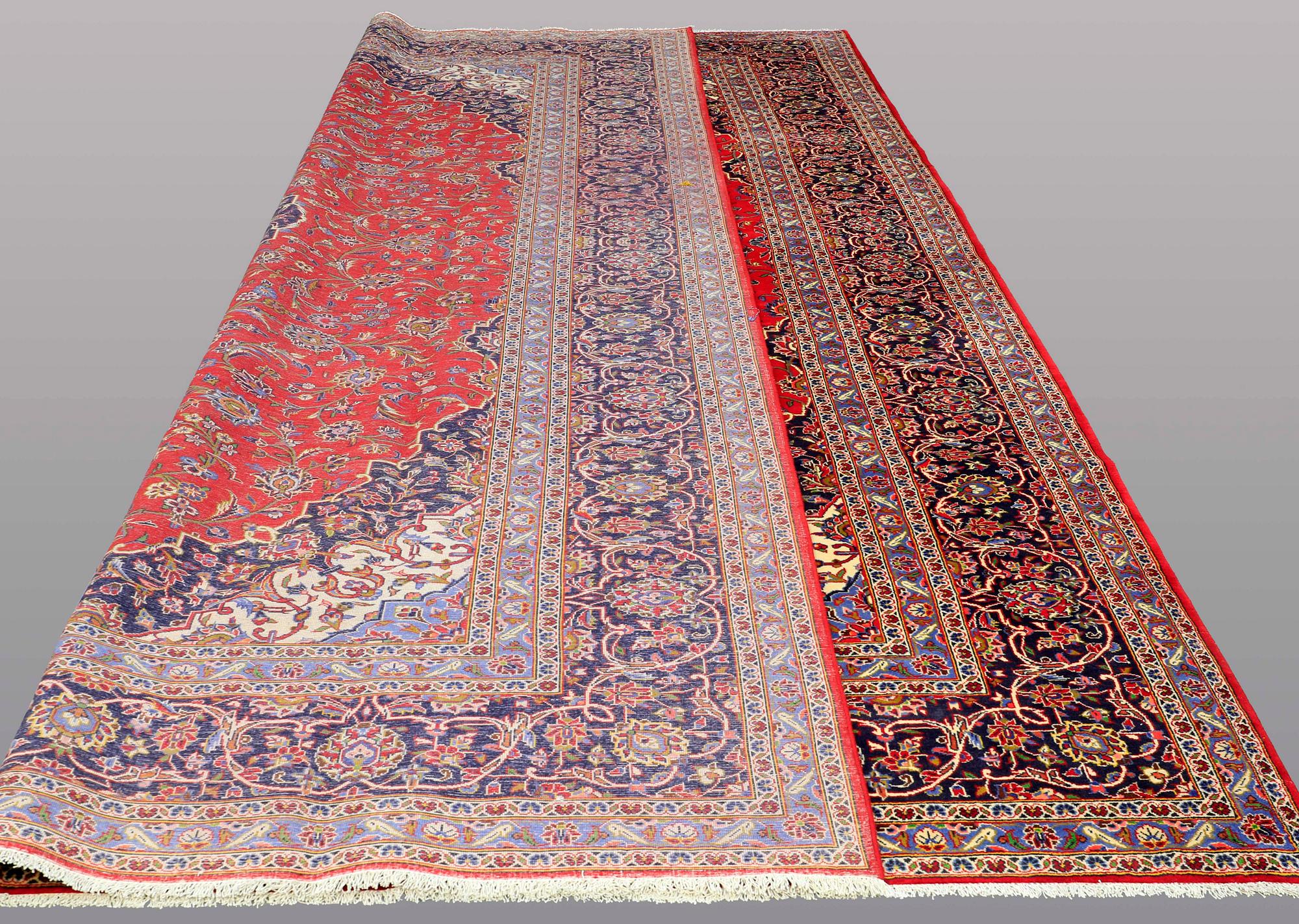 A signed Kashan carpet ca 490 x 289 cm.