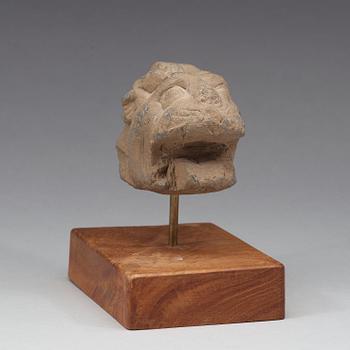 A schist sculpture fragment of a lion, Gandhara, 2nd-3rd Century.