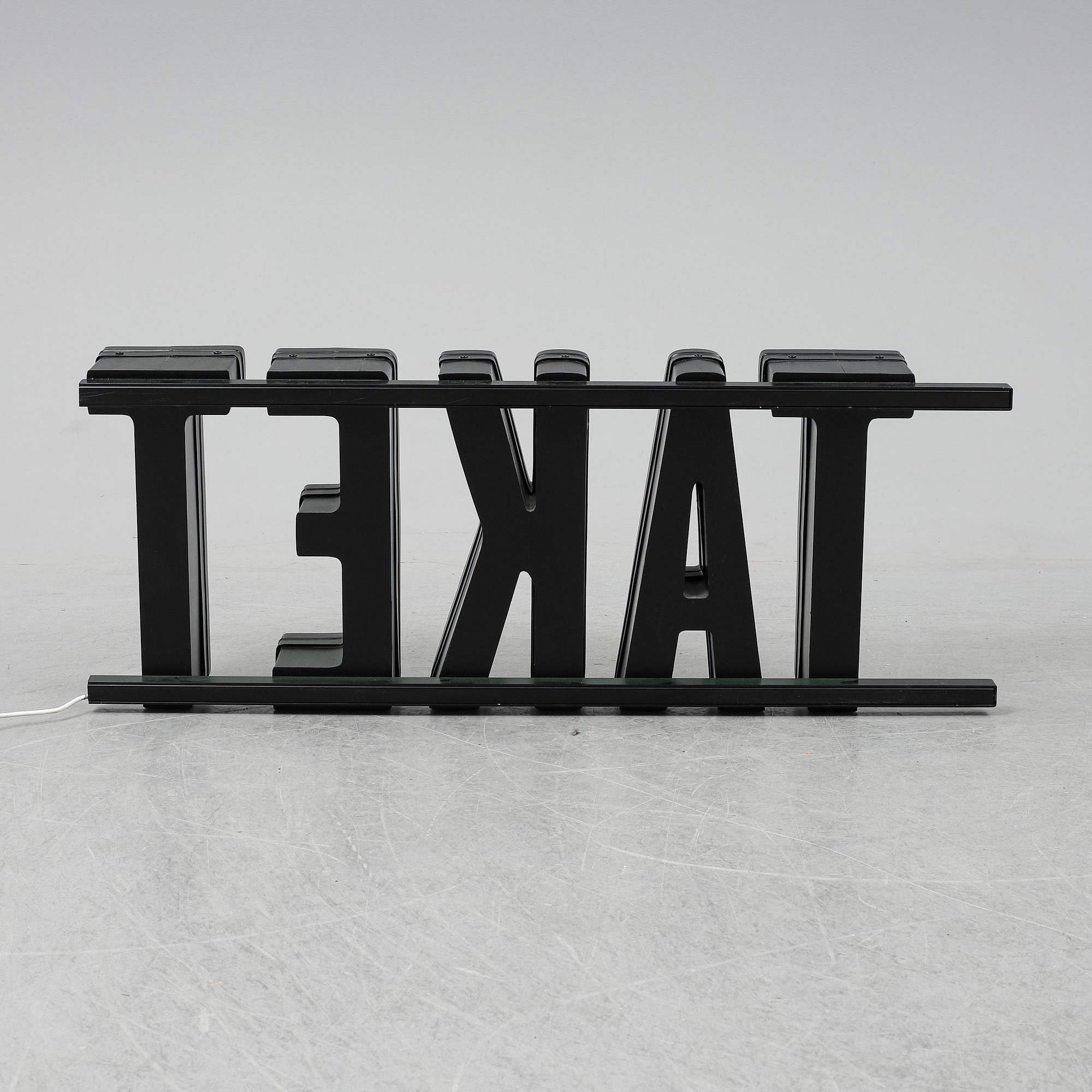 A neon sign "TAKET", late 20th century/21st century.