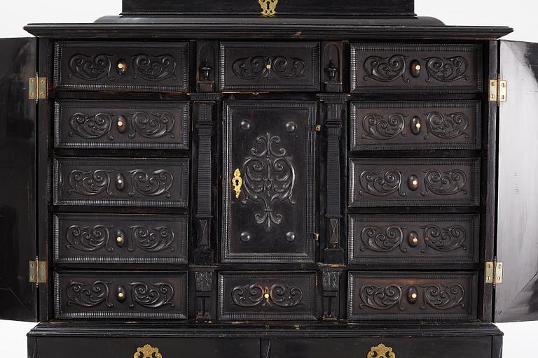 A South-German Baroque ebonized collector's cabinet on stand, circa 1700.